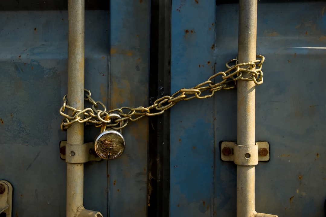 Digital padlock securing a network diagram with connected devices, symbolizing Network Access Control (NAC) at the network edge.