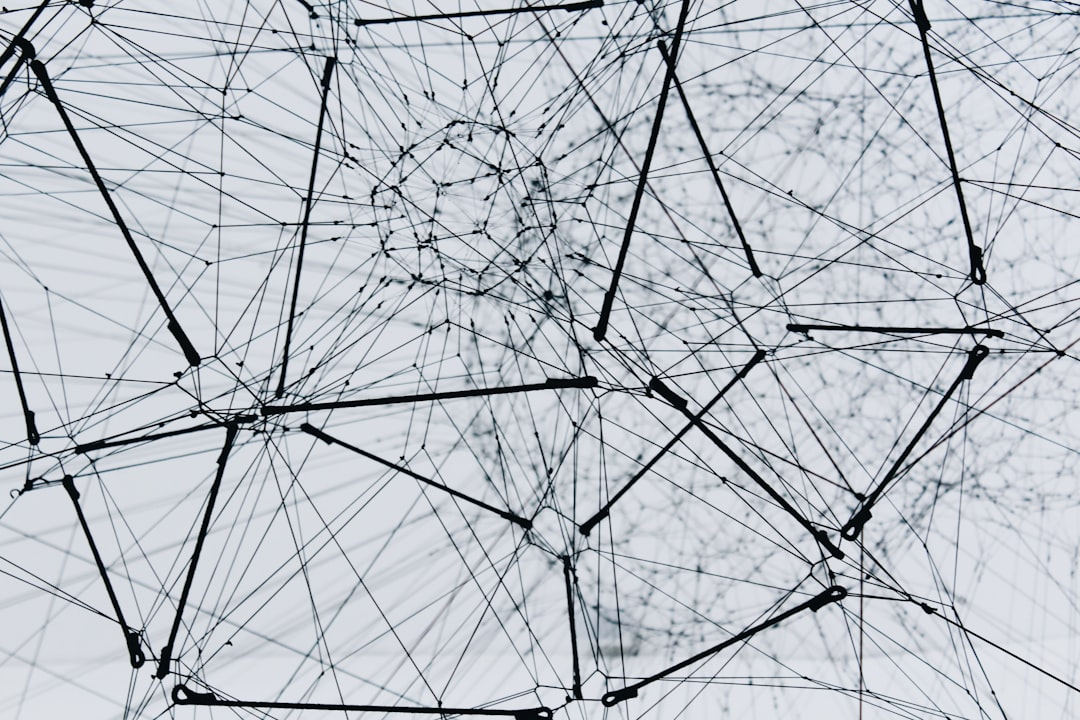 A glowing, interconnected digital network visualization representing complex attack paths in a cybersecurity environment.