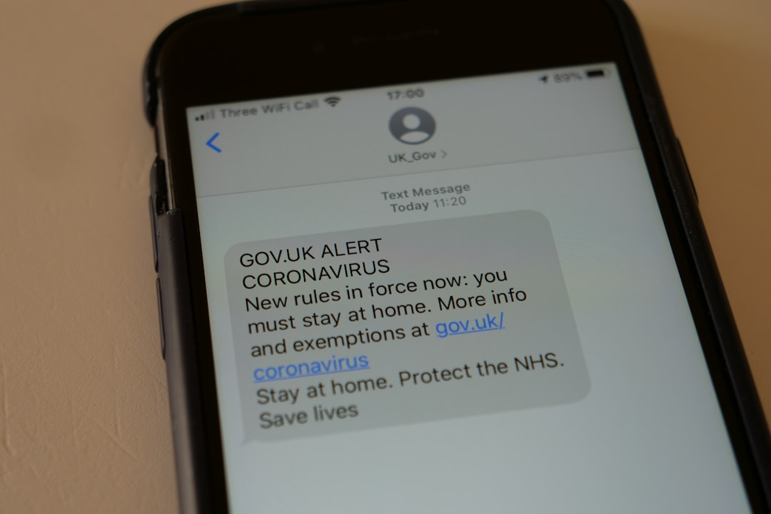 A digital representation of a smartphone displaying a fake delivery notification alert, symbolizing the threat of SMS-based phishing.