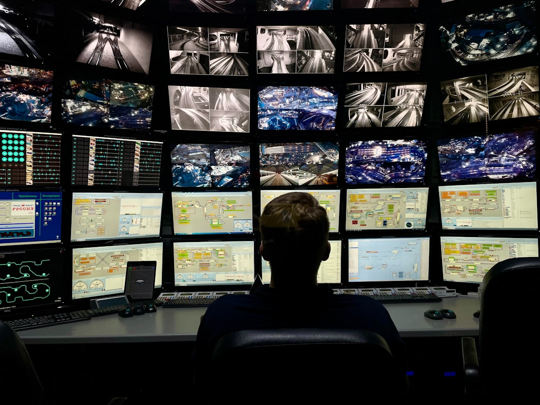 Cybersecurity analysts monitoring a dashboard with threat alerts and data visualizations.